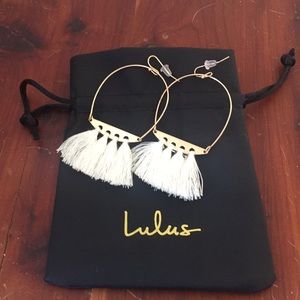 Gold and white earrings.